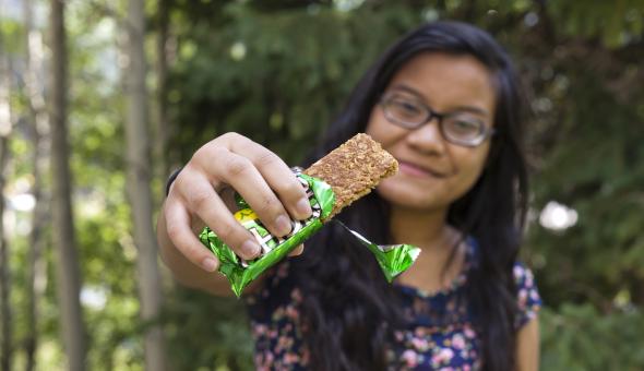 Girl with granola bar