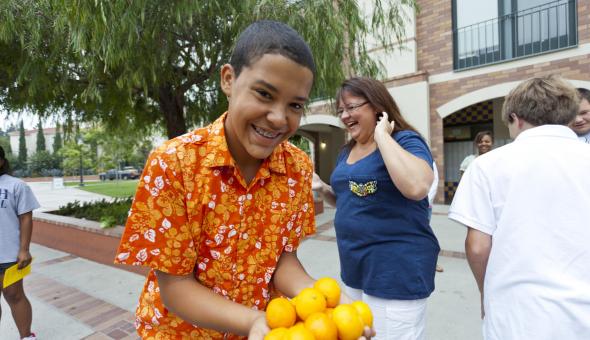 Boy holding lemons