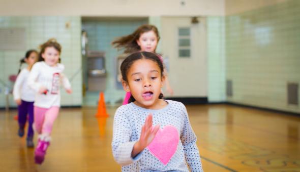 Girl running in gym