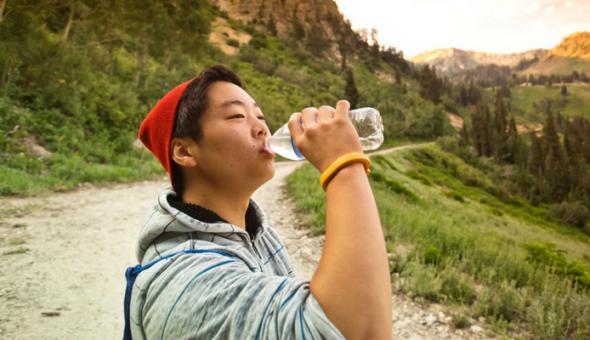 Boy Drinking Water Outside