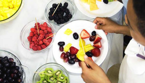 Boy with fruit bowls