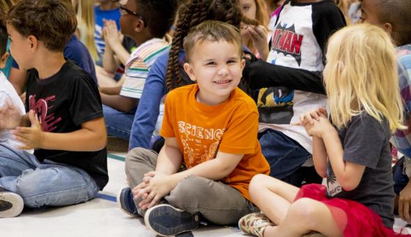 Excited kids sitting