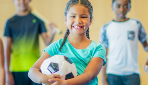 kids posing with various sports equipment
