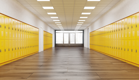 Empty school hallway with yellow lockers