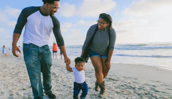 Family on beach with child