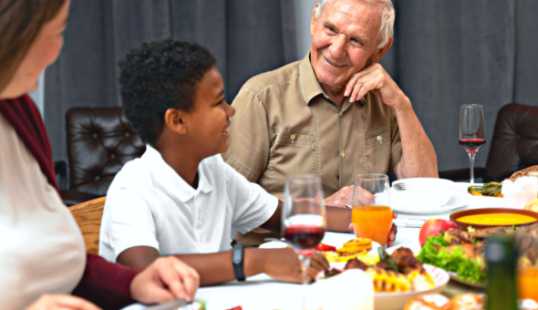 Family gathered at table for dinner