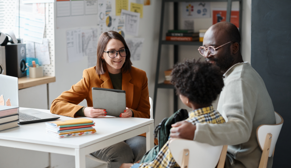Teacher has discussion with parent and student