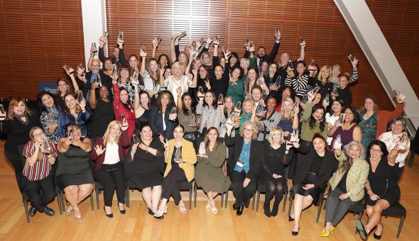 2024 Leaders Summit awardees pose with their awards