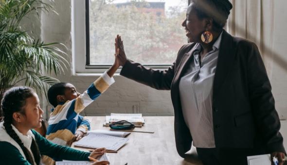 Teacher high fives student