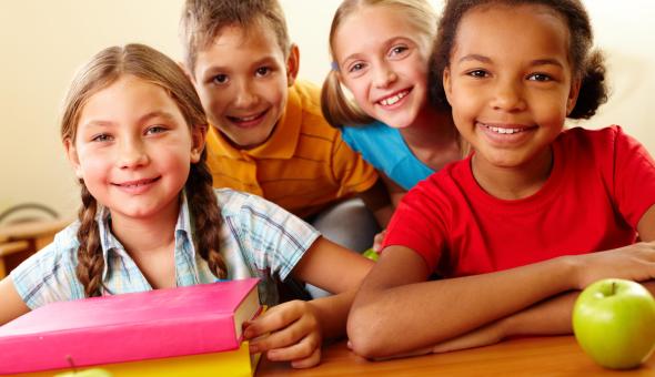 A group of four school-age children.